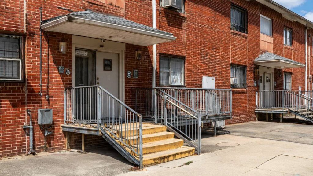 Guide To Ssi Apartments For Rent A modest apartment building with accessible features such as ramps and wide entrances, representing housing options for SSI recipients.