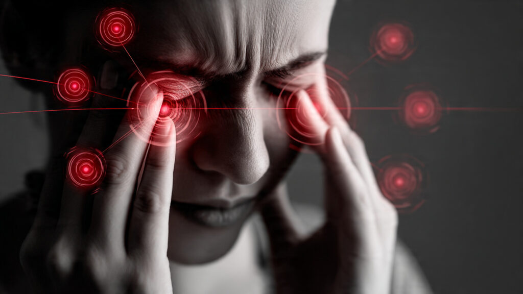 Cold Or Sinus Infection 3 Signs To Watch For A person touching their forehead and cheeks with a visual overlay highlighting sinus areas to represent pressure and discomfort