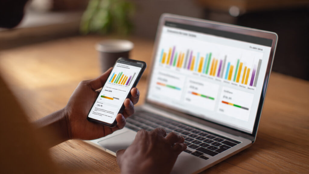 Person checking their credit score on a digital dashboard in 2025.